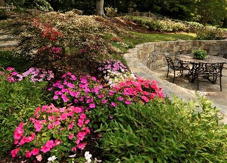 Stone wall with colorful plantings